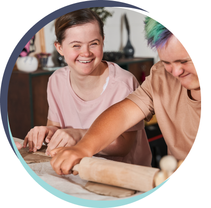 person rolling out dough