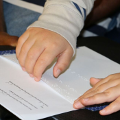 person reading braille